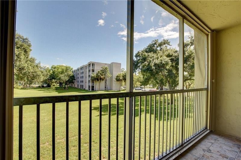 Photo of 8735 Ramblewood Drive #212, Coral Springs, FL 33071 (MLS # B26089559)