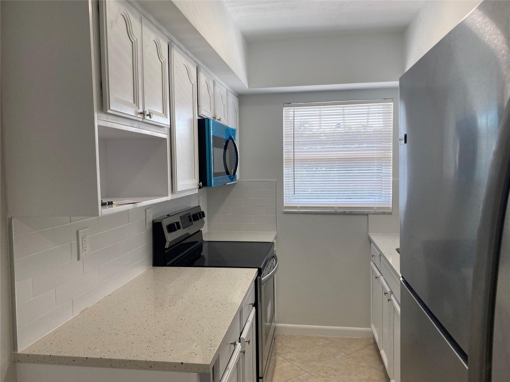 Photo of 853 SE 4TH Court #Apt 14, Deerfield Beach, FL 33441 (MLS # B26073257)