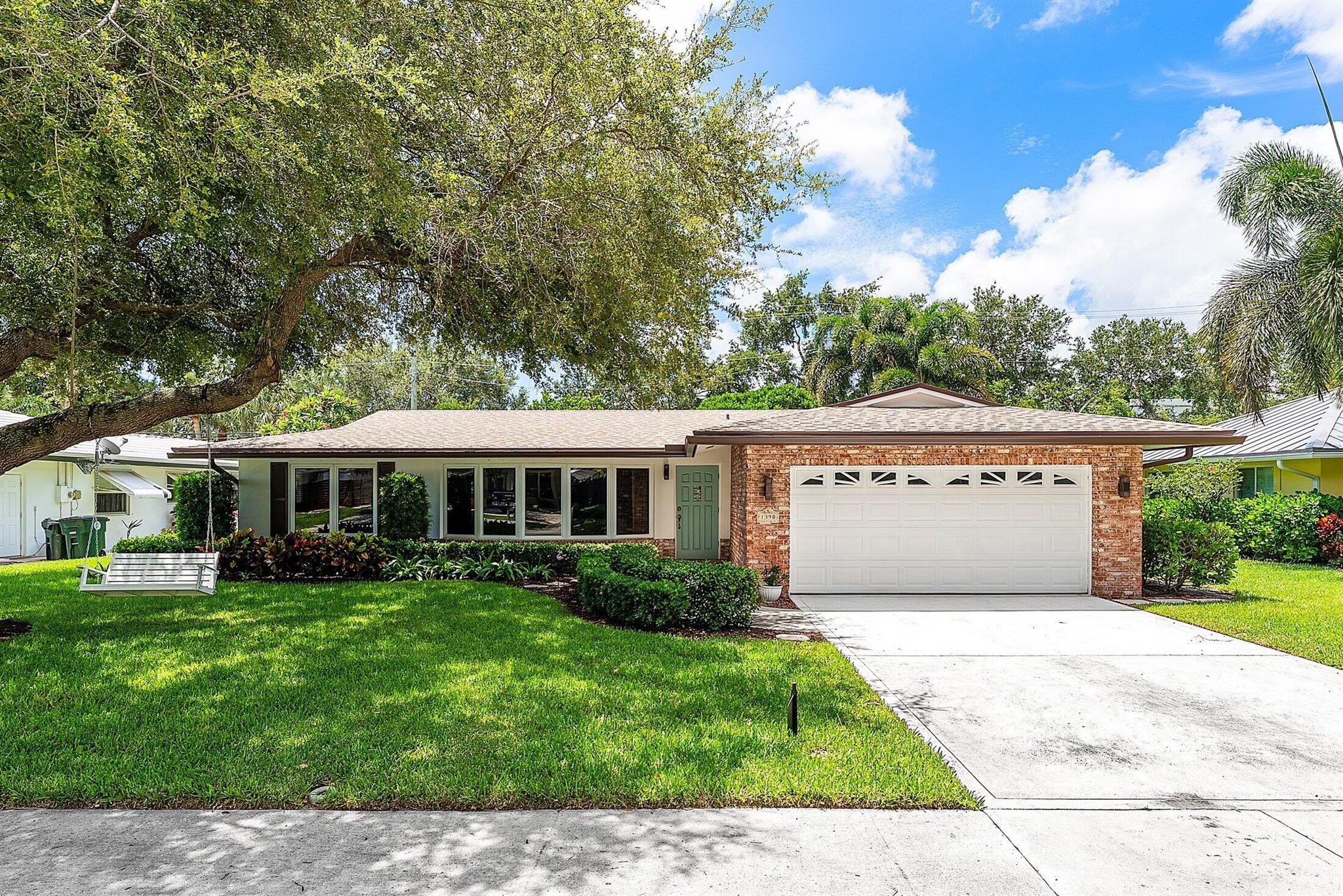 Beautifully updated 4 bedroom home in East Boca's Addison Mizner School District! From the moment you arrive, the charming curb appeal welcomes you--and inside, the spacious interior feels just like home. Fully updated and meticulously maintained, this house is ready to enjoy. New roof in 2024, full impact windows and doors, and an updated electrical panel. Beautiful luxury vinyl plank flooring. New A/C duct work. The resort style pool and hot tub were just renovated, featuring new tile, coping and diamond brite. Heated Pool. Screened-in patio with large covered area. Fully fenced-in yard, with a section of turf. Epoxy floors in the garage. This is an outstanding opportunity to live in a desirable East Boca neighborhood just minutes to Boca Raton's best attractions.