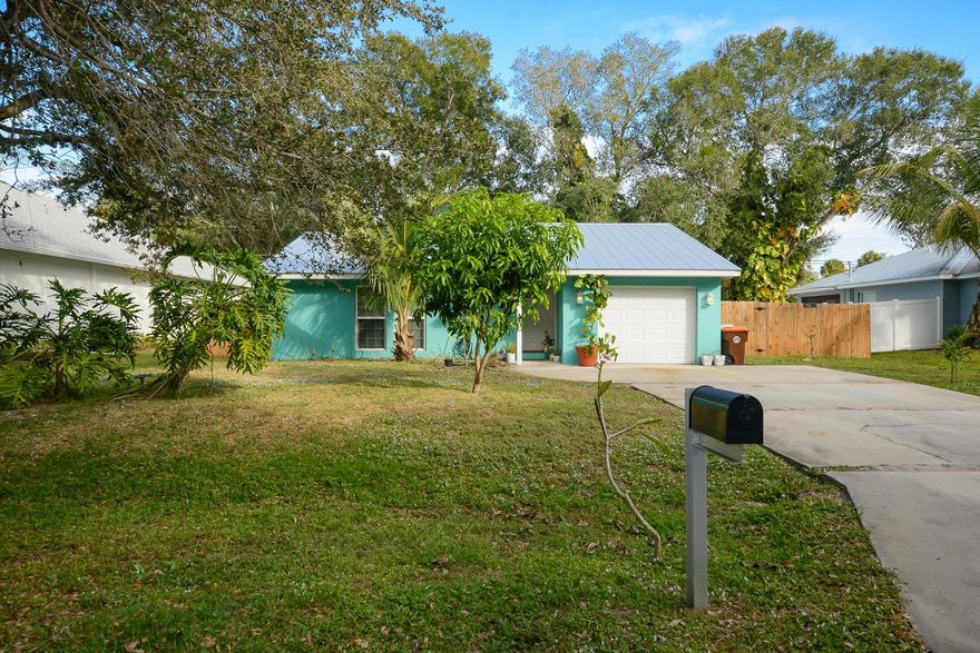 Simply charming, this cottage-style home sits on a quaint street and offers 3 bedrooms, 2 bathrooms, and a 1-car garage. The generous lot provides ample outdoor space, complete with a handy shed, while the drainage canal behind the property adds an unexpected touch of privacy, making this home both cozy and inviting.