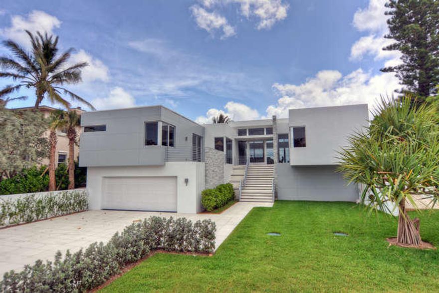 This contemporary masterpiece epitomizes style and elegance. Thoughtfully appointed. This 4 bedroom 4.5 bath home has very high end design styling such as the piano finish cabinetry, quartz and recycled sea glass counter top, stack marble wall. A magnificent full height glass wall in the kitchen. So many sophisticated design touches that start from the front door with the magnificent glass pivot door, a catering kitchen, and a glistening pool that uses the ocean as a back drop. Just does not get any better than this.