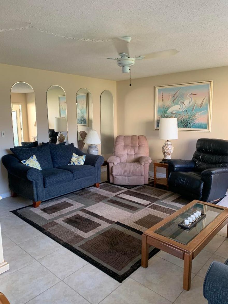 First Floor 2/2 condo with golf views from enclosed porch! Tiled throughout. Newer windows. Located near clubhouse, pool facility. Close to shopping, beaches, etc.