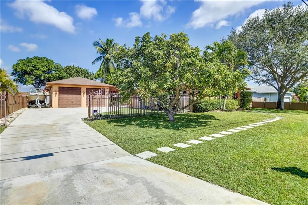 Photo of 5015 NW 77th Ct, Pompano Beach, FL 33073 (MLS # F10319276)