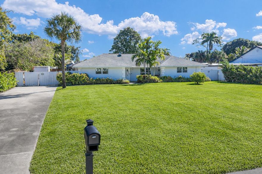 Live like you're Off the Grid while being in the City, just minutes from the Beach! Welcome to this Fully Renovated Private Retreat Home. Set on nearly half an acre, This Freshly Painted 3 Bed, 4 FULL Bath Home with inground pool and a driveway to fit 10+ cars features: New Tile Flooring throughout, New Recessed Lighting, New Linear Vents, New Ductwork, AC less than 5 yrs, New Tankless HWH, New Custom Shades, Updated Kitchen with SS appliances, Impact Windows, Updated Baths w/frameless glass. The house is wired with an alarm, cameras & an EV charger. The Private Backyard Oasis is screened in, paved w/ Travertine, Equipped w/ an Outdoor Kitchen, a Pergola w/electric louvers, an Outdoor Shower, a Firepit & Fruit Trees galore. Room for a Boat, RV & all your outdoor toys. All Yours w/no HOA!!