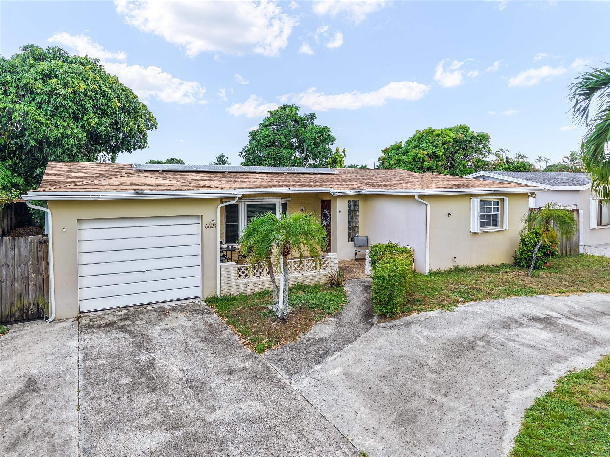 Welcome to this charming 3-bedroom, 2-bathroom home, perfectly situated in the heart of Margate. Enjoy South Florida living at its best with your own private pool and a spacious backyard filled with mature mango and avocado trees—a true paradise for garden lovers and outdoor entertainers!
The covered back patio is ideal for weekend cookouts and family gatherings, offering a perfect space to relax or host guests. Inside, you’ll find a comfortable layout with natural light pouring in through a mix of impact windows and hurricane shutters for added peace of mind. The home also features solar
panels, helping to significantly lower your monthly electric bills. Whether you're looking for a forever home or a smart investment, this property offers it all—location and lifestyle.