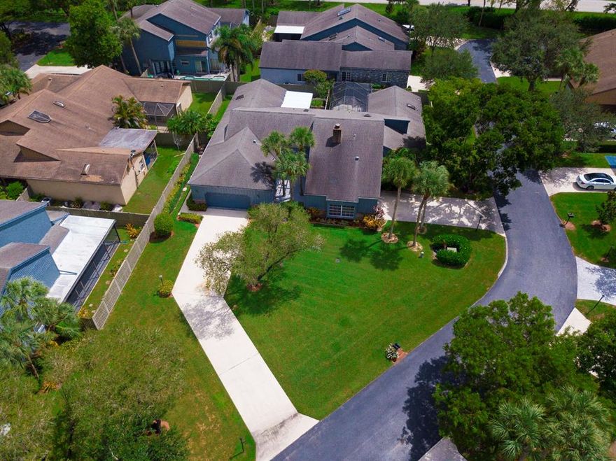 This move-in ready, 3 BR/2 Bath, single story home is set among the tranquil, mature tree canopies of Parkland's most charming & rarely available neighborhoods... The Mews of Cypresshead. This villa home features a spacious open living area w/ volume ceilings, a beautifully updated kitchen &  bonus room (or 3rd bedroom if converted back), a separate office & laundry island w/ tons of storage & laundry tub. Skylights & windows w/ plantations shutters allow plenty of light to flow throughout. Other features: a large private deck (off the 3rd BR/bonus room), a sprawling, oversized front yard size & your pets will love the wrap around backyard w/ privacy fence & huge screened in patio. The master BR features, a huge walk-in closet & bathroom w/ dual sinks & a shower with a built in bench.