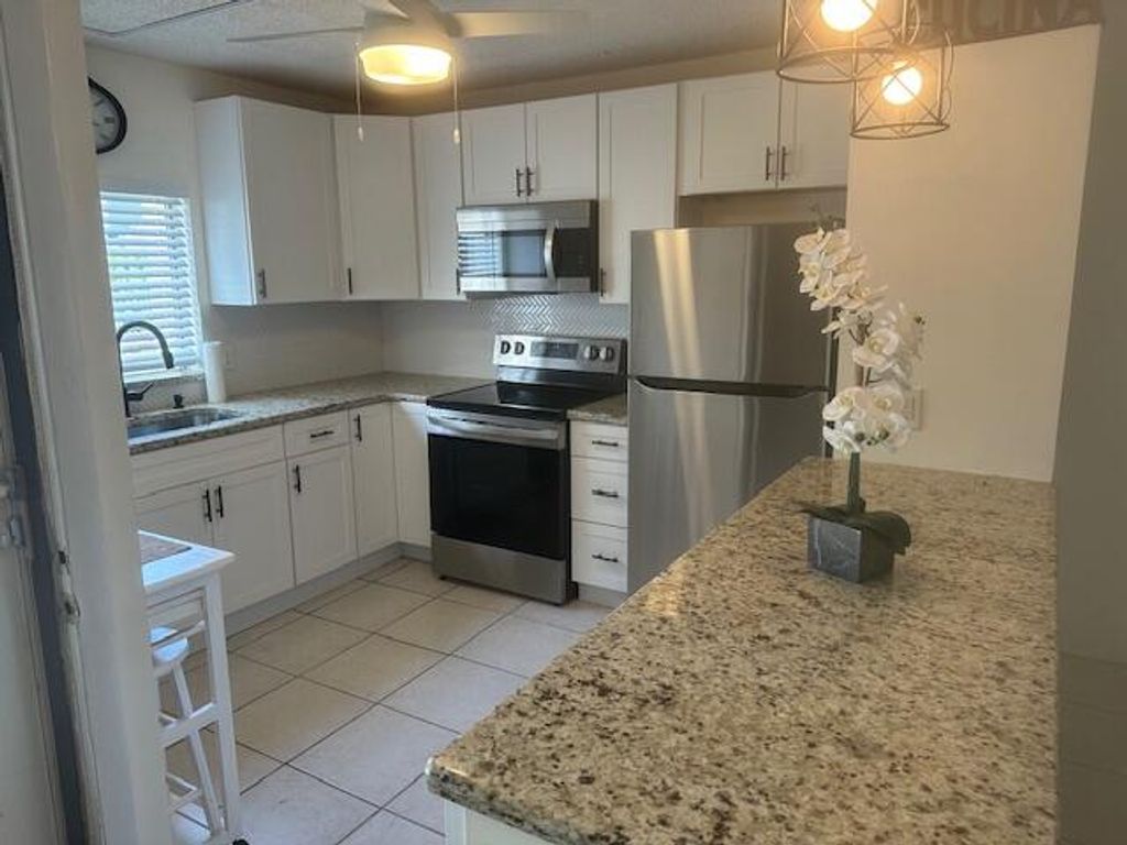 Photo of 1561 NE 12th Terrace #C7, Jensen Beach, FL 34957 (MLS # B26004428)
