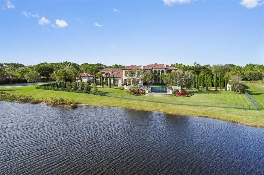 Located on 2.5 acres in the exclusive Stone Creek Ranch community, this magnificent estate sits on exquisitely landscaped grounds with sweeping lakefront views. Designed in a modern Metropolitan style, this eight-bedroom home features casual elegance that invites both private living and festive entertaining. Stone and grass terraces surround the 25'x 50' infinity pool and spa, with reflective pools flanking each side. Enjoy outdoor living with a covered loggia, fireplace, lounge, dining area and full summer kitchen. The double-gated circular entrance leads to the seven bay garage and private tennis court. Other features include a chef's kitchen, wine room, gym, 9-person theater, custom designed office, game room loft and full house generator. The smart home operates on a control 4 system.