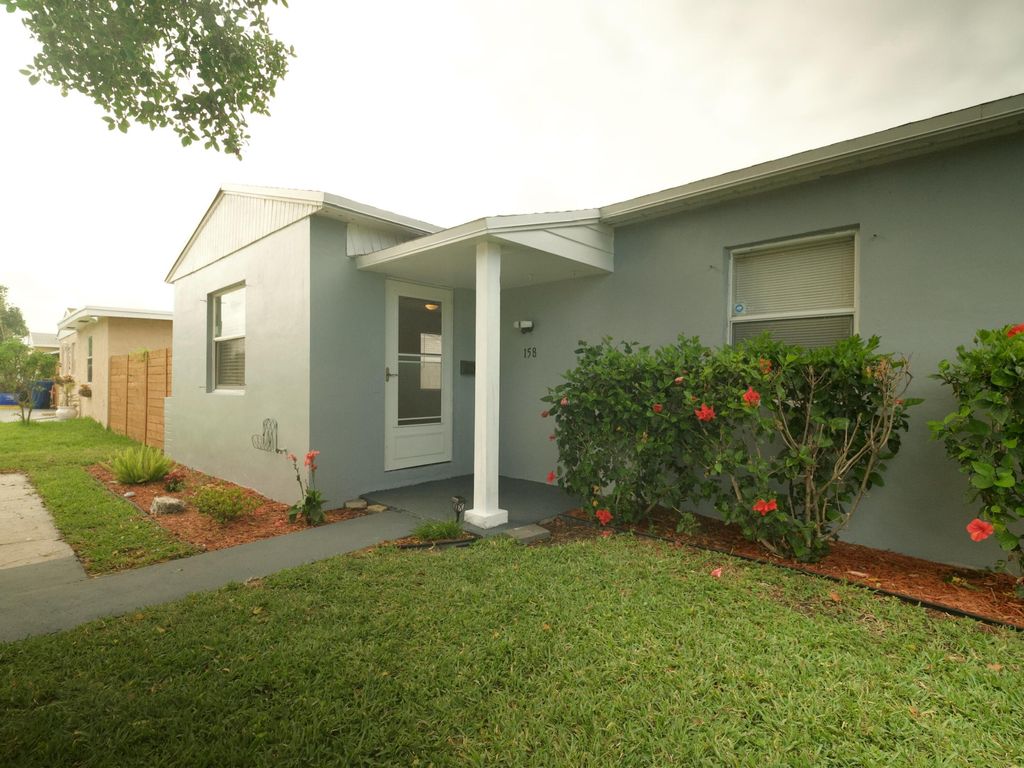 Photo of 158 W 25th Street, Riviera Beach, FL 33404 (MLS # B26017654)