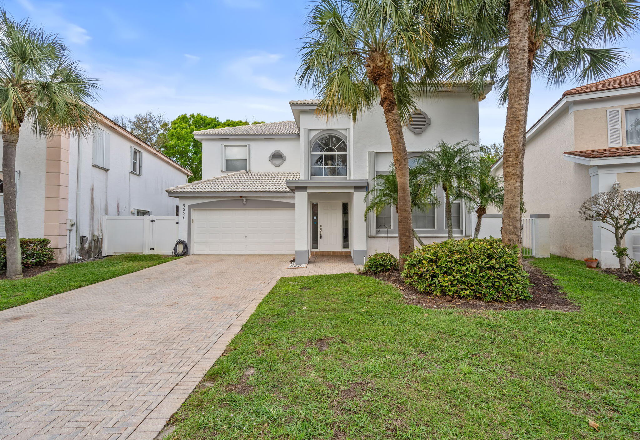 This beautifully renovated 3-bedroom, 2.5-bath home with a 2-car garage offers modern upgrades and exceptional privacy. The custom kitchen features sleek stainless steel appliances and granite countertops, which are also found in all bathrooms. Updated flooring throughout ensures a carpet-free living space. Enjoy peace of mind with a manned guard gate, an additional private gate, and 24/7 on-site security. The spacious backyard and screened patio provide the perfect setting for outdoor relaxation and entertaining. A great place to call home!