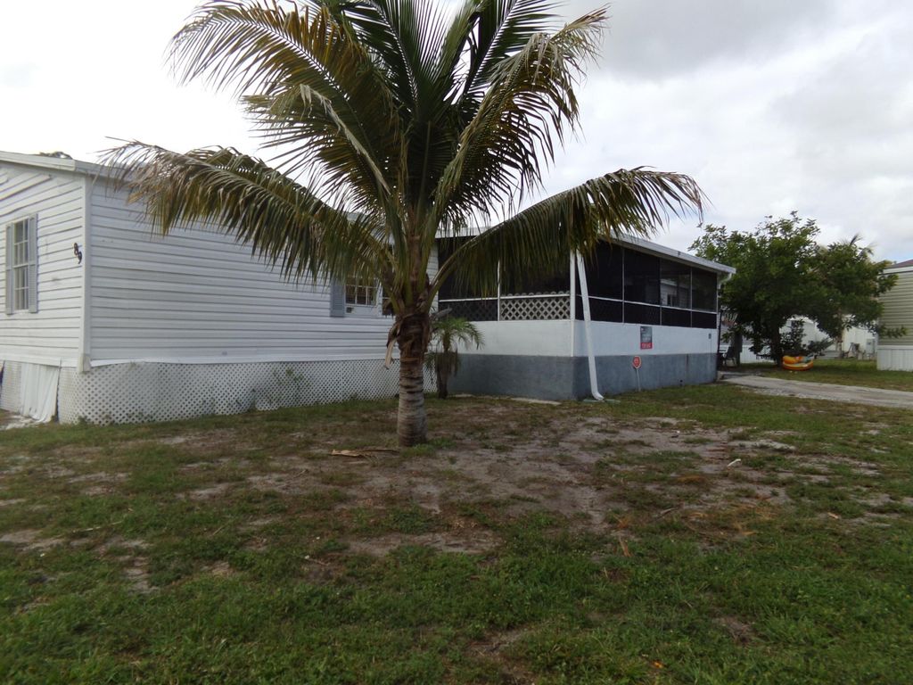 Photo of 89 S Stuart Circle, Greenacres, FL 33463 (MLS # B26017736)