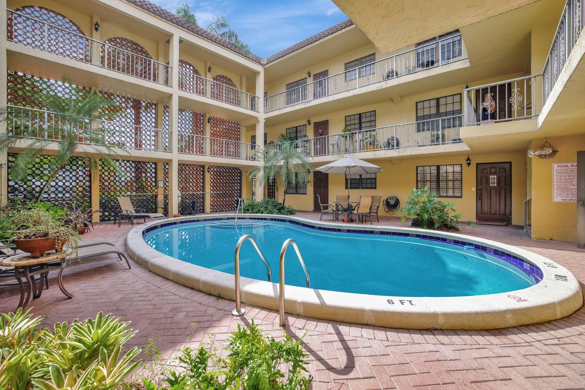 Located in Ft Lauderdale's sought-after Victoria Park neighborhood, this 2nd floor condo has a split floor plan with a generous sized living room which offers an abundance of natural light from the planation shutter windows. New waterproof laminate flooring throughout! The Kitchen features a sit-at bar, plenty of cabinets, and a formal dining area that can also be utilized as an office/den area. Both bedrooms are spacious with en-suite bathroom & walk-in closet. The building amenities include: gate w/passcode entrance, pool, BBQ area, and on-site laundry facilities. *But HOA does allow Washer & Dryer in unit! Being only moments away from Holiday Park, The Galleria Mall/Shops, Eateries, The Beach and Las Olas this prime location is hard to beat! Note: Unit is rented until October 2025.