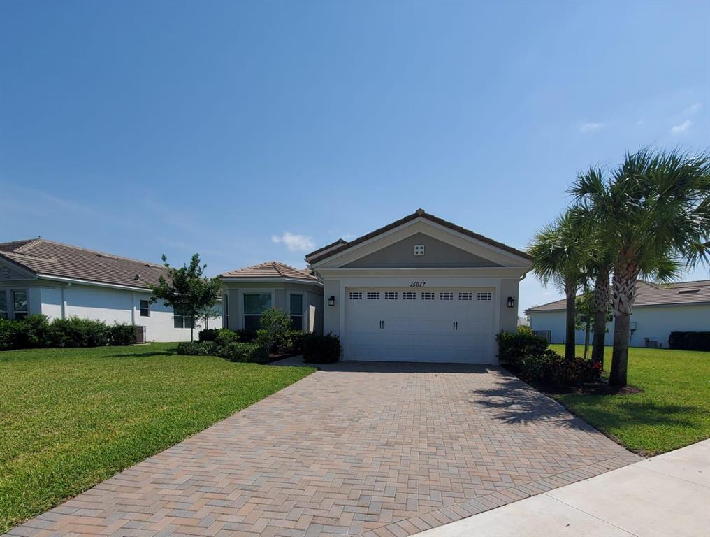 Beautiful, 3 bedroom, 2 bath, 2 car garage Marlberry model on an oversized, fenced yard model. 42 inch cabinets, granite, tile, carpet in bedrooms, lake view, huge covered patio, laundry sink, impact windows and more. Home is available as soon as tenant is approved by the homeowner's association. Looking for first, last, security, excellent credit and income. Hammocks of Westlake is a highly sought after community. Westlake's resort style amenities include a lagoon pool with 3 story slide, splash pad for little ones, cabanas, lawn space for parties, outdoor concert pavilion, basketball courts and adult pool (coming soon), playground, dog park, pump park for BMX enthusiasts and much more.