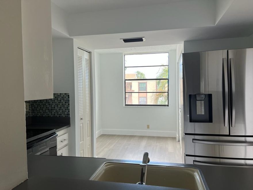 GORGEOUS CORNEL BRIGHT CONDO: 2 Bed / 2 Bath + Bonus Room / Lanai  + LAUNDRY IN UNIT + Low association + Community has Reserves. Kitchen boasts modern all wood cabinetry, STAINLESS STEEL APPLIANCES, and  tons of storage.  Amenities include LARGE COMMUNITY POOL, club house, Gym and much more! ASSOCIATION DUES INCLUDE all amenities, Water, Cable, garbage and recycling, amenities, exterior pest control, exterior building insurance.  55+ COMMUNITY has Reserves. 10% down payment and association $1075 Quaterly.  Sit In Your Air Conditioned Florida Room.  650 credit Req'd. Conveniently located near restaurants, shops, and the FL turnpike. This home has been very well kept and is ready to move into. Washer and dryer in unit! MUST SELL, AS-IS,