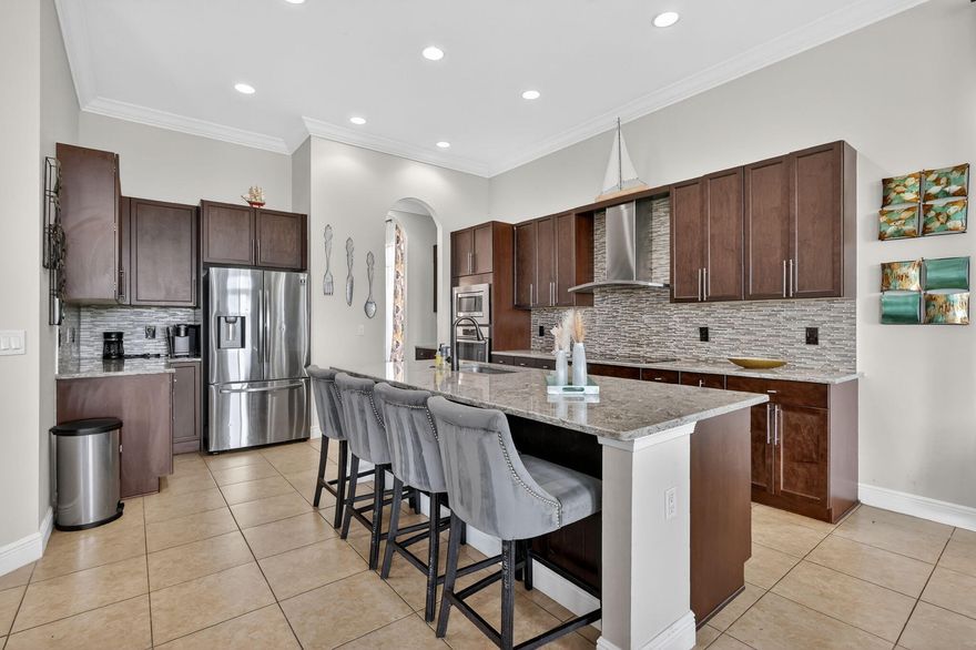 Large price drop and seller willing to offer up to $25,000 for upgrades.  Use that for downpayment assistance or upgrades your choice.  Luxury living in PGA Verano! This stunning 2019 Kolter-built home offers 4 bedrooms and 4.5 baths with serene views overlooking the C24 canal. Designed for both comfort and elegance, this home is nestled in a prestigious guard-gated community featuring resort-style amenities including golf, tennis, pickleball, and a grand clubhouse. Enjoy wide golf cart-friendly roads, sidewalks, and beautifully lit streets. Experience upscale living at its finest in one of the area's most sought-after communities!