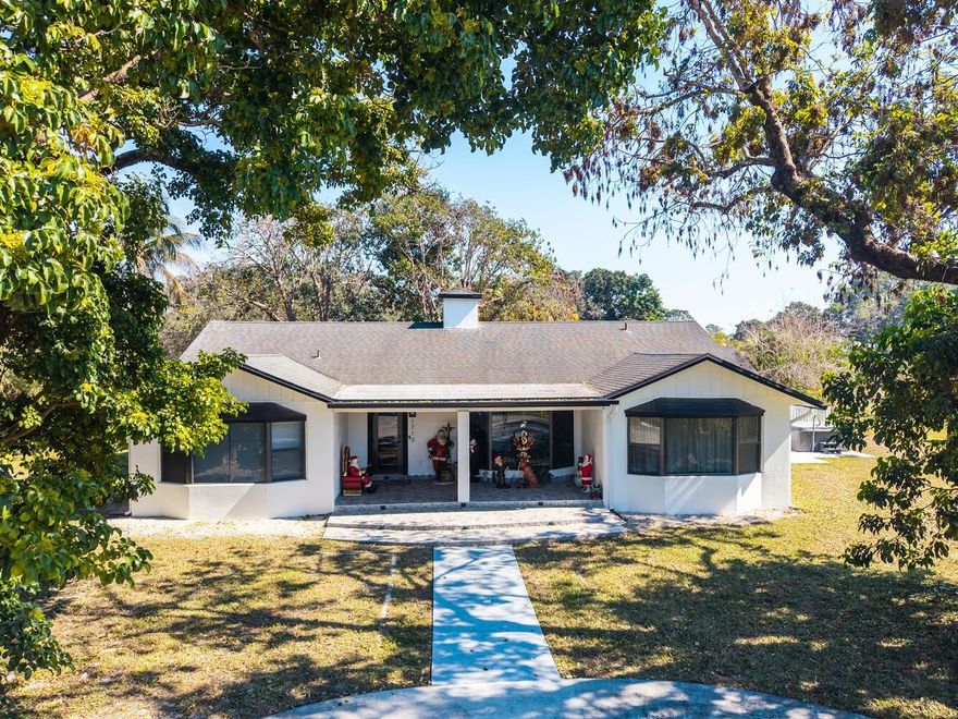 OWNER FINANCING ASSISTANCE AVAILABLE! AWAY FROM IT ALL YET NEAR TO EVERYTHING! CROSS A SMALL BRIDGE TO TOTAL PRIVACY ON 1.23 ACRES! NEW IMPACT WINDOWS/DOOR! OPEN CONCEPT, BAY WINDOWS, QUARTZ KITCHEN, SS HOOD, UPDATED APPLIANCES! TRIPLE SPLIT PLAN, MAIN BDRM HAS NEW UPGRADED BATH, 2 WALK-INS & TANKLESS WTR HTR! IN-LAW SUITE HAS SPA TUB. 5TH BR CAN BE PVT OFFICE+LIBRARY+SITTING RM OR HOME SCHOOL! LGE LAUNDRY ROOM. ENJOY OUTDOOR ENTERTAINING ON ROOFED PATIO/POOL/NEW THERAPEUTIC HOT TUB! EXTENSIVE BACK YARD-HUGE PVT REAR DRIVE HOLDS MANY CARS, TRUCKS, BOATS, MOTOR HOMES! 1200 SQ FT WORKSHOP TOTALLY REBUILT! NEW 26K GENERATOR & 1K GAL GAS TANK! EXC. SCHOOLS, HORSES WELCOME, ACCESS  DAVIE'S REC TRAILS, SHOPPING, DINING, HOUSES OF WORSHIP & HIGHWAY ACCESS! THIS IS A WONDERFUL PLACE TO CALL HOME!