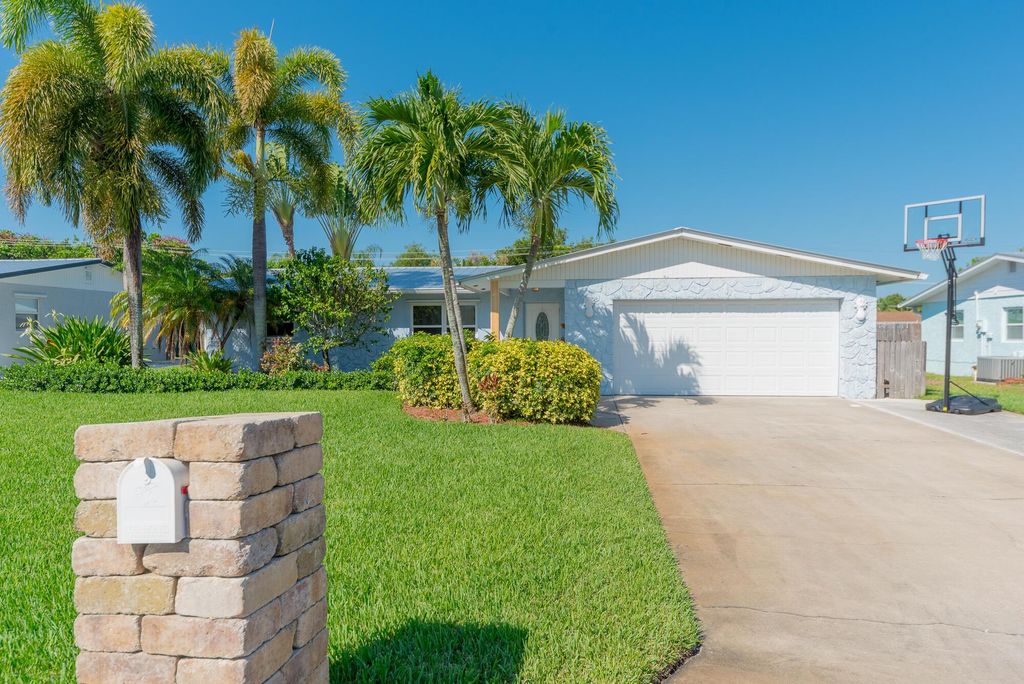 Photo of 1484 NE 24th Street, Jensen Beach, FL 34957 (MLS # R10962684)