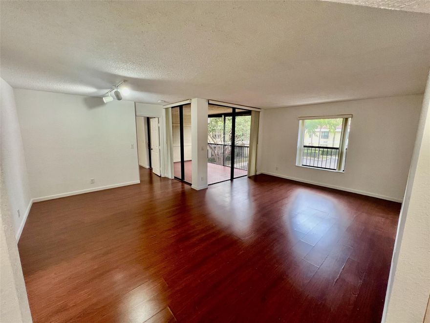 RESORT-STYLE LIVING! Stunning 2/2 Condo within The Township, Coconut Creek!! All the amenities: Tennis, pools, ballroom, impressive clubhouse, jog/walk trail around beautiful lake!! Great size unit, lovely split plan layout, wood laminate floors in social areas and bedrooms. Tile floors kitchen and bathrooms. Washer & dryer inside and it has a beautiful screened in balcony!! Makes it fantastic home!! (Owner requires 700 credit score for all applicants).