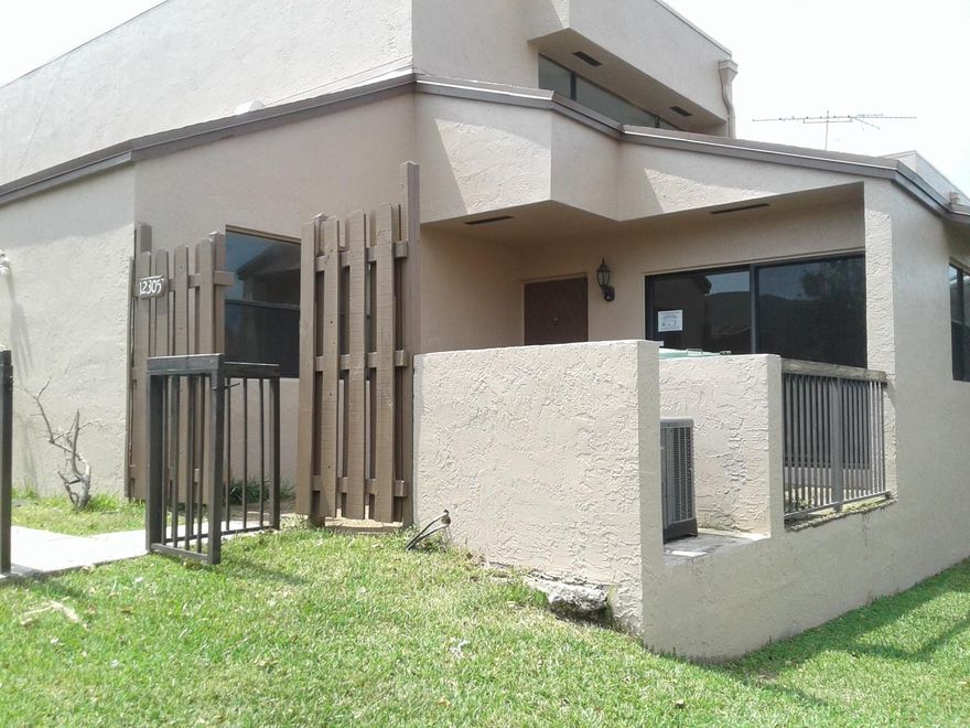 GATED TOWNHOUSE COMMUNITY OF FLAMINGO LAKES  *  2 STORY 2 BEDROOM 2 BATH WITH WATER VIEWS * REMODELED NEW : CENTRAL AC / APPLIANCES / CARPETING / PAINT / FIXTURES  * SPLIT BEDROOM PLAN WITH BEDROOM AND BATHROOM ON GROUND FLOOR  * FRONT PATIO * MANY AMENITIES: BASKETBALL COURTS / TENNIS COURTS / RAQUETBALL COURTS / POOL / GATED COMMUNITY WITH PATROLING GUARDS * LOW MAINTENANCE  & MUCH MORE * No investor purchase for first 20 days