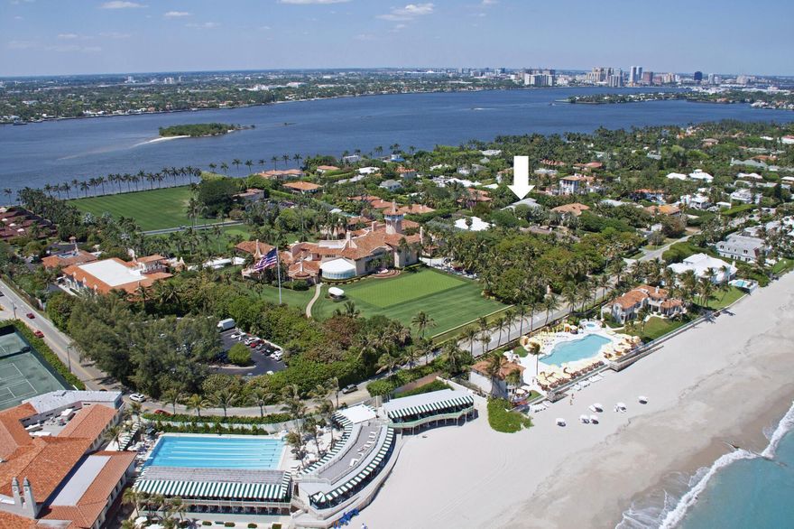 Live just one street away from The Mar-A-Lago Club and enjoy exclusive guest privileges to the club (no initiation fee), pending an interview process and payment of annual dues. This is the only street on the island that holds this declaration of use agreement with Trump, making it truly one-of-a-kind.Situated just three properties from the ocean, this Mid-Century Modern home is set on an elevated 14,810 SF lot and features a 5-bedroom main house along with a two-story guest house. The main house includes a ground-floor primary bedroom with an en suite bath, as well as a second-floor primary suite with a generous walk-in closet, flex room, and patio overlooking the pool. A spacious living room serves as the centerpiece of the home, complemented by a grand foyer, pocket sliding doors l