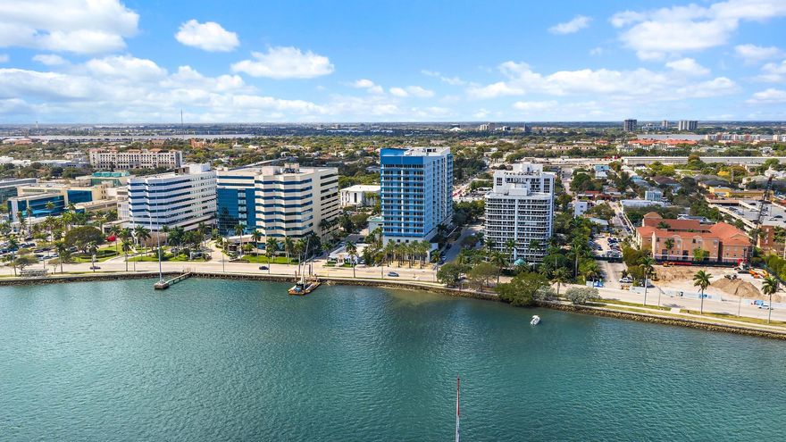 Penthouse-level living with 10' ceilings and sweeping northeastern views of the ocean, Intracoastal, Palm Beach, and city skyline. This end-cap unit offers added privacy with no visible neighbors and an abundance of natural light throughout.
The split-bedroom floor plan features two spacious bedrooms, modern finishes, bamboo wood flooring, impact windows, and in-unit laundry for everyday convenience. Unit includes 2 deeded garage parking spaces.  Building amenities including two pools, a fully equipped gym, business center, valet parking, and a 24/7 front desk attendant-- seeking a lock-and-leave lifestyle or retirees looking for comfort, security, and walkable waterfront living.