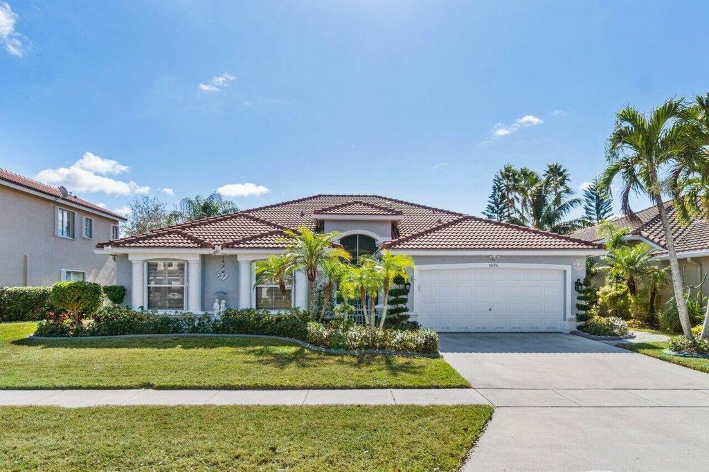 Photo of 5696 Muirfield Village Circle, Lake Worth, FL 33463 (MLS # R11158774)
