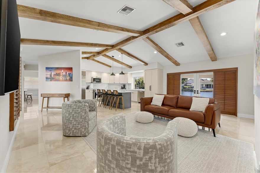 *TRULY MOVE IN READY* 4BR/2.5BA waterfront home in Plantation offering 2600+ sq ft of upgraded living space on a quiet cul-de-sac. Features include a remodeled kitchen with beautifully exposed ceiling beams, Sub-Zero refrigerator, New metal roof, 2024 AC, and a newly resurfaced pool (2026). Hurricane-ready with impact-rated garage door and full shutter system including accordion and Key West shutters. Smart-home features include Nest thermostat, Ring security, and alarm system. Move-in ready and meticulously maintained, conveniently located minutes from Downtown Fort Lauderdale for work and play!