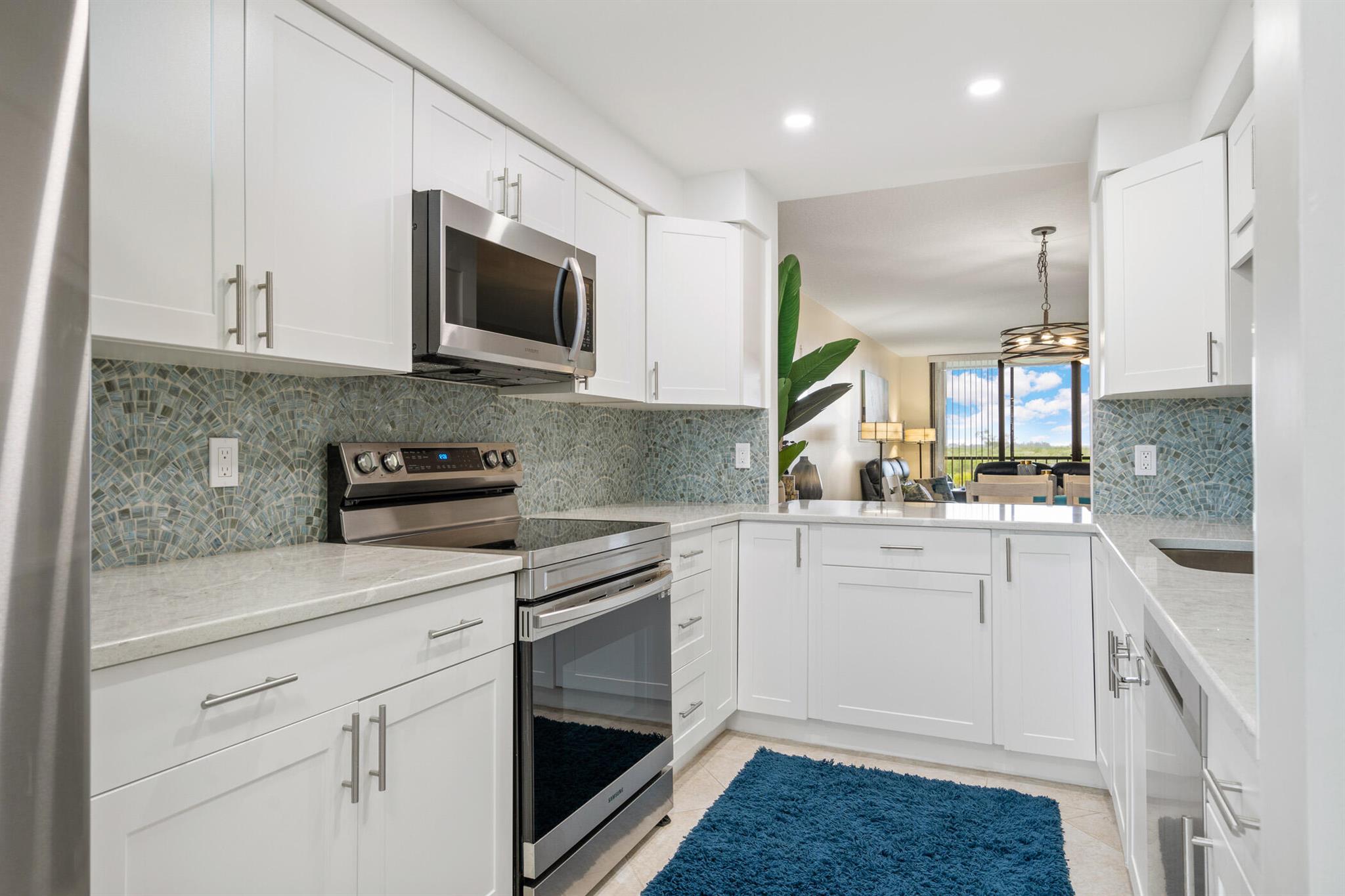 Every day feels like vacation in this completely remodeled condo along the Indian River. Enjoy tropical breezes & vibrant sunsets from your expansive covered balcony. EVERYTHING IS NEW-A/C, roof, W/D, tile flooring, lighting, paint, reimagined bar area. The baker will love the brand new kitchen layout w/Quartz counters, SS appls, pantry. Luxurious baths w/new tile, cabinets, & counters. Enjoy living in nature's playground as you kayak or relax on the beach, just a short walk away through a pedestrian tunnel. Happy hours are a beloved tradition. Sold completely turnkey-just bring your sunscreen