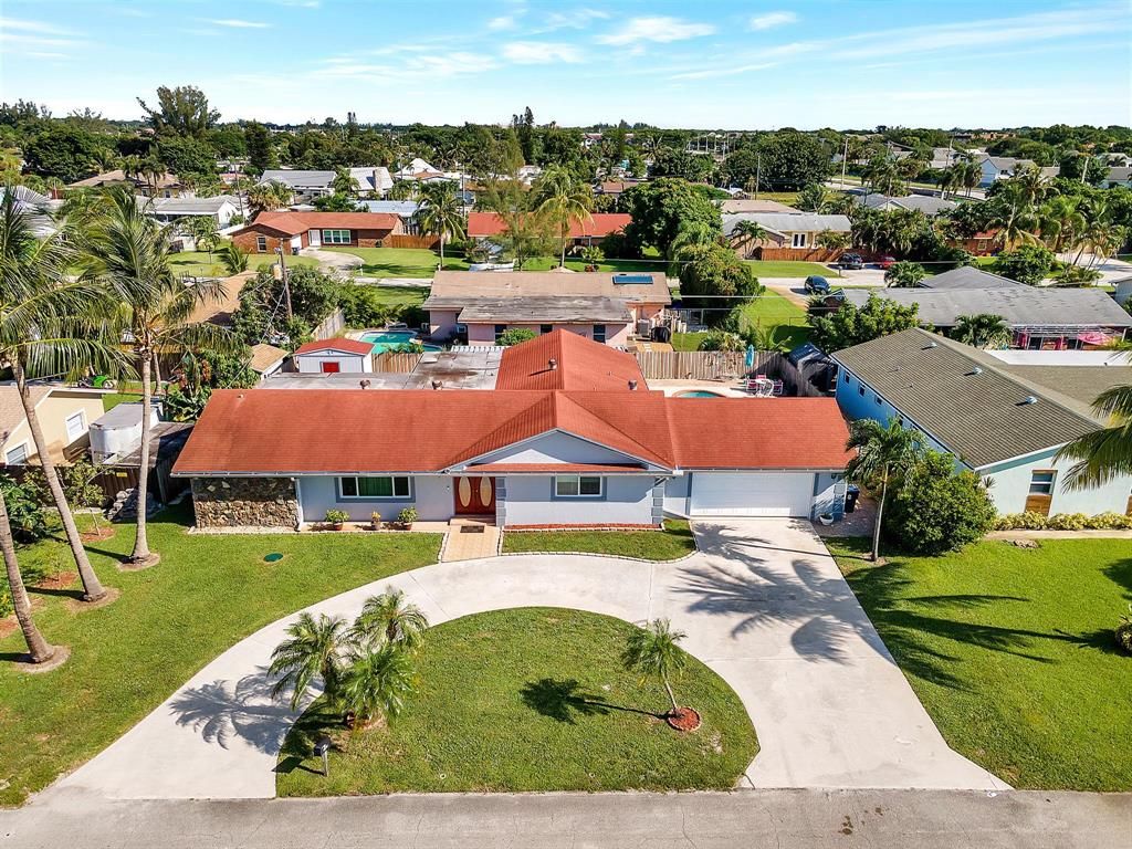 Photo of 3059 Emerald Lane Ln, Lake Worth Beach, FL 33462 (MLS # R10745629)