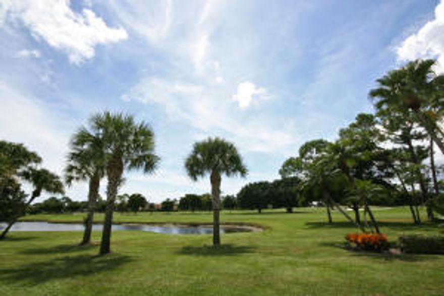 Southeastern exposure with beautiful lake view.  Consider this welcoming 3 bedroom 2 bath lake-view residence located on the 1st floor in lovely Blue Heron section of Quail Ridge. Sliders on paved patio provide extra entrance to kitchen.  Spacious and open living areas.  Large master bedroom suite with step-in shower and dressing area.  Sliders from master to living area. Guest bedroom with large custom walk-in closet.  The third bedroom is being used a den, but has a pleated shade closure for privacy if needed.  Plantation shutters in den and living area and master bedroom for privacy and light management. The kitchen has cream painted cabinetry, white appliances and pergo laminate flooring. Easy walk to Clubhouse & Golf.  Priced right and so nice! New Clubhouse 2017! Mandatory membership.  Quail Ridge is a private, member-owned community and club. All residents are members of Quail Ridge Country Club and have a choice of either a golf or a social/tennis membership.