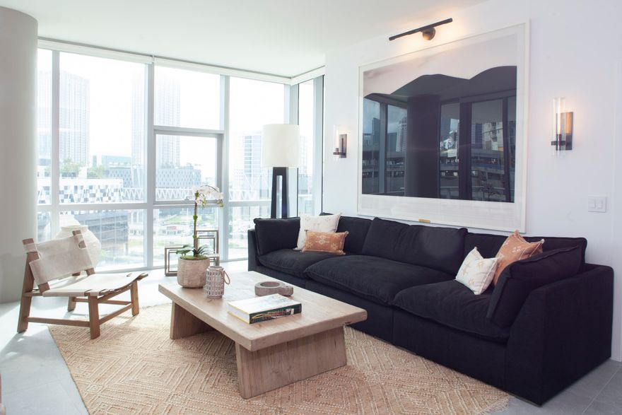 ELEVATE YOUR LIFE at one of Miami's most recognized residential destinations: Paramount Miami Worldcenter. This three-bedroom plus den residence features a reimagined open layout, modern design elements, and floor-to-ceiling glass showcasing expansive city and bay views from every room. A private balcony extends the living space and highlights the skyline's architectural landscape.
Residence 812 includes generous living and dining areas, a well-appointed kitchen with Miele and Sub-Zero appliances, quartz surfaces, designer tile work, and custom cabinetry. All bathrooms feature elevated finishes, upgraded fixtures, and thoughtful detailing throughout. Located within the Miami Worldcenter district, this address provides access to a broad range of retail, dining, entertainment, and cultural destinations throughout downtown Miami. Its central position offers connection to many of Miami's most notable attractions, including the Design District and the beaches.
Paramount Miami Worldcenter is known for its extensive amenity collection, including multiple resort-style pools, a Sky Deck with 360-degree views, basketball court, spa, fitness center, lounges, and a contemporary lobby experience. As part of one of the largest private master-planned developments in the United States, residents enjoy a comprehensive range of on-site offerings.

851 NE 1st Avenue #812 represents a rare opportunity to own a residence defined by elevated design, expansive views, and proximity to one of Miami's most dynamic urban districts.