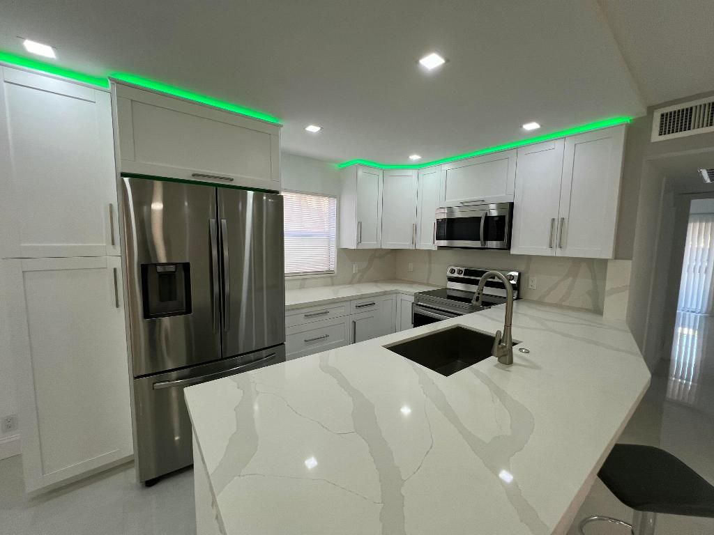 Photo of 440 Saxony J, Delray Beach, FL 33446 (MLS # R11074918)