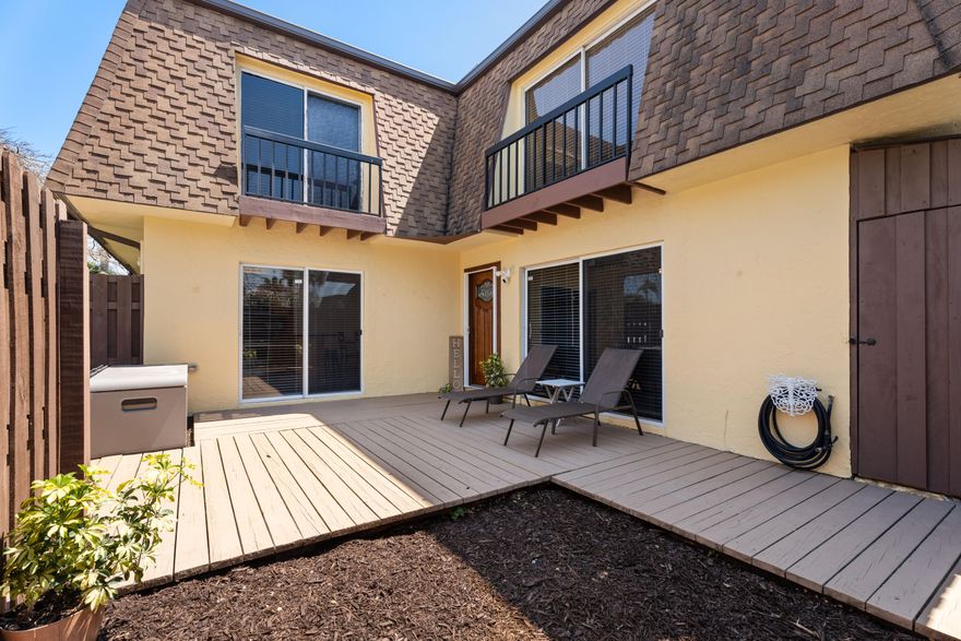 Updated 2BR/2.5BA townhouse in desirable Sims Creek in Jupiter. Remodeled kitchen with large island, granite counters, and stainless appliances opens to dining and living areas. Spacious first floor flows to a private fenced courtyard, ideal for indoor-outdoor living and entertaining, plus half bath and in-unit washer/dryer. Upstairs features two private bedroom suites with en-suite baths, walk-in closets, and balconies overlooking the courtyard. New roof (2022) adds peace of mind and long-term value. Minutes to beaches (10-15 min), Harbourside Place, Riverwalk, dining, shopping, and marinas. Easy access to US-1 and I-95, and approx. 25-30 min to Palm Beach International Airport. Close to golf, waterfront parks, and vibrant downtown Jupiter. Includes two assigned parking spaces.