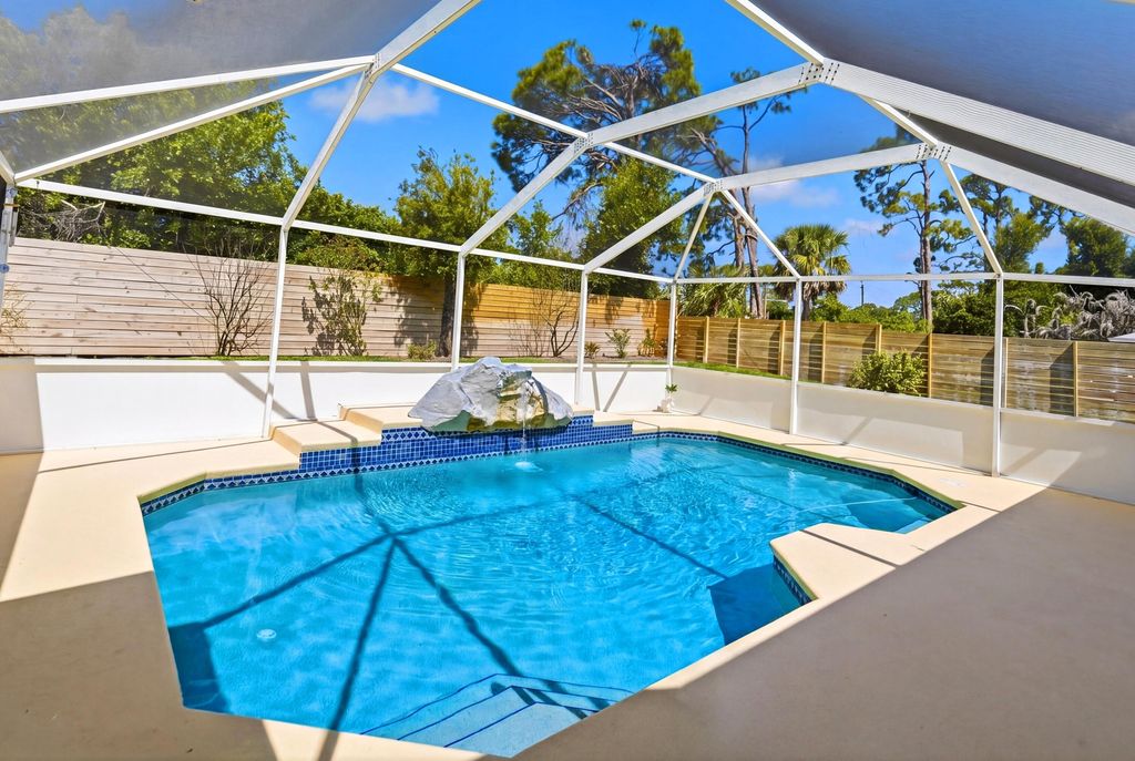 Photo of 5105 Paleo Pines Circle, Fort Pierce, FL 34951 (MLS # B26023002)