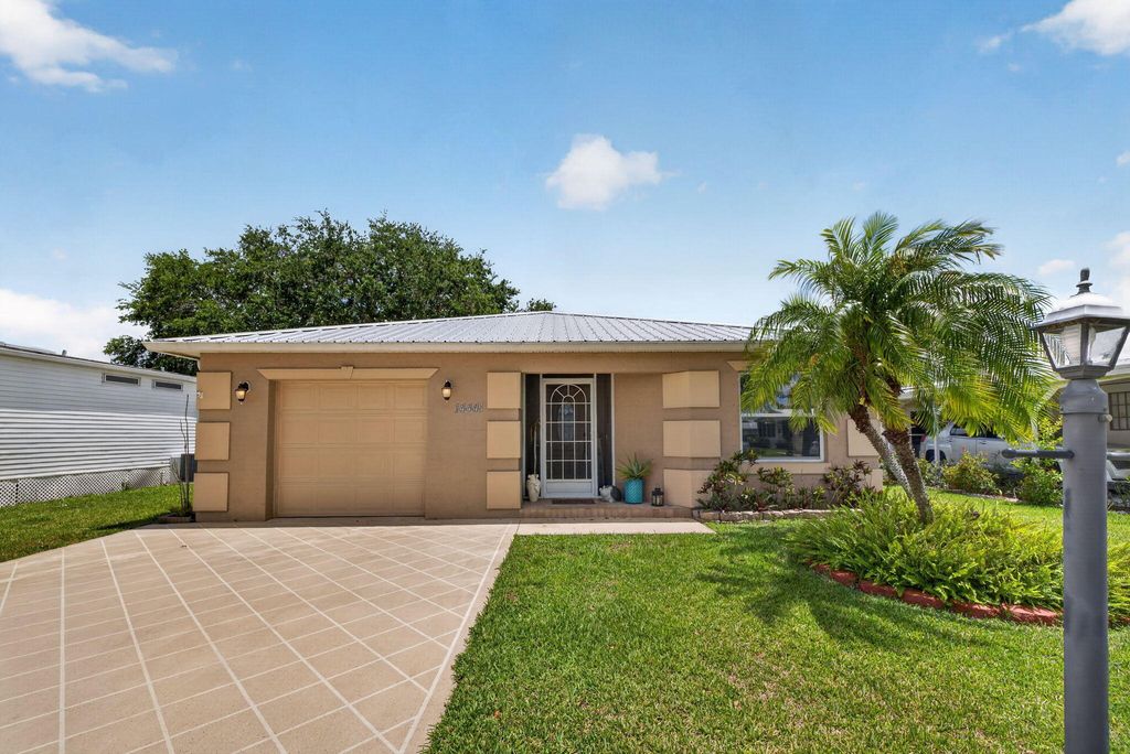 Photo of 14441 Dulce Real Real, Fort Pierce, FL 34951 (MLS # B26030782)