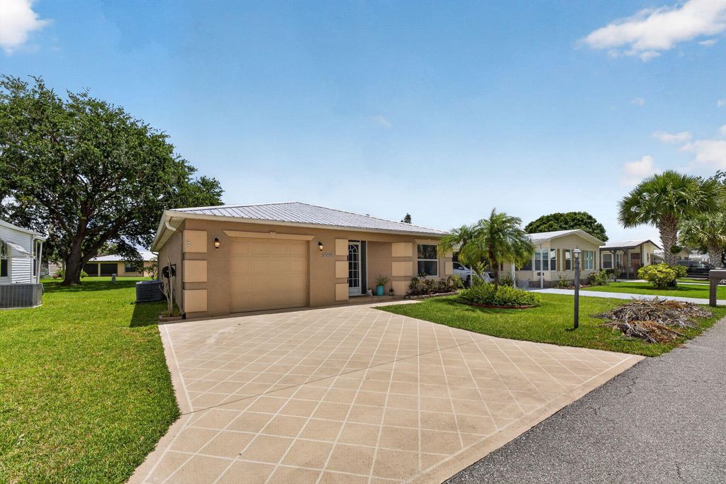 Photo of 14441 Dulce Real Real, Fort Pierce, FL 34951 (MLS # B26030782)