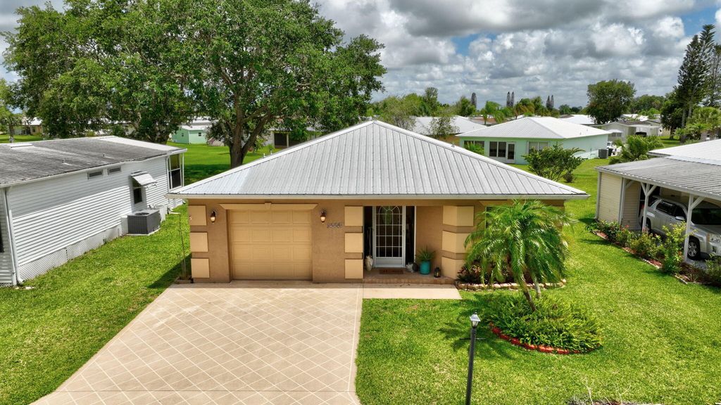 Photo of 14441 Dulce Real Real, Fort Pierce, FL 34951 (MLS # B26030782)