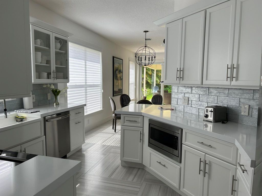 Photo of 2404 NW 67th Street, Boca Raton, FL 33496 (MLS # R11107581)