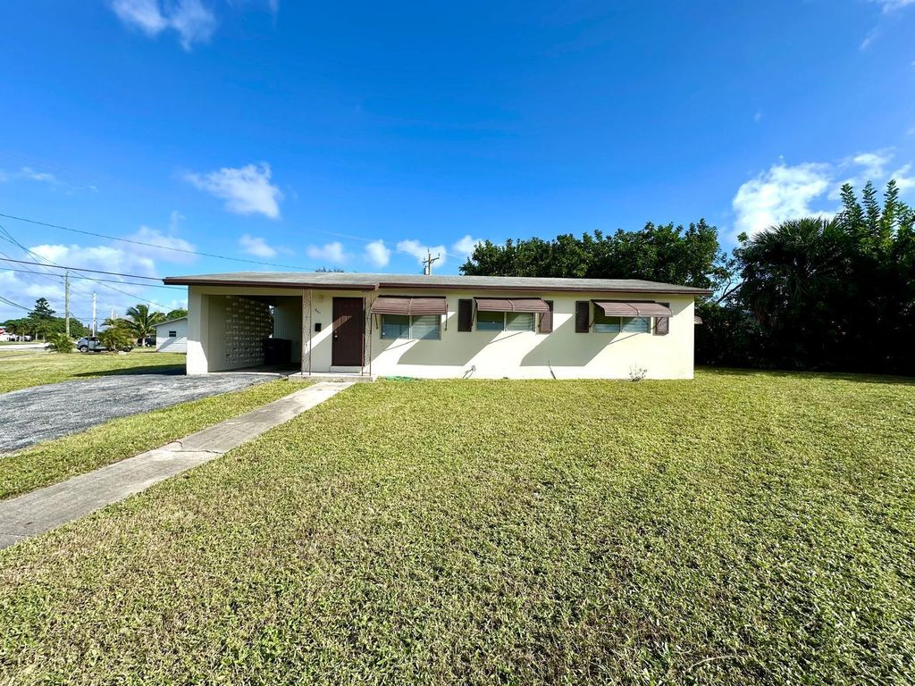 Photo of 861 W Ilex Drive, West Palm Beach, FL 33403 (MLS # R11034198)