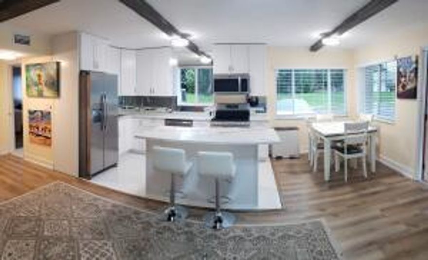 55+ Light and bright 1st floor: NO STAIRS! Park right next to your front door! Available Turnkey. Open concept Living area, huge bedroom w/spacious closets, crown molding, new kitchen & appliances, quartz counters & table-top, big island-extra storage. Year-round comfy enclosed patio. NEW ROOF-2024. NEW TANKLESS WATER HEATER-2024 NEW-A/C-2020. ACCORDIAN HURRICANE SHUTTERS on all windows. Big utility/storage room. Laundry and mailbox just steps away. WALK across the street to HEATED POOL, John Prince Park & Lake Osborne w/walking-biking trails, boating! CLUBHOUSE with activities to suit your lifestyle. Shuffleboard, Billiards & Social Gatherings. 2.9mi to beach, 8.2mi to PBI Airport, 1.3mi to I-95.