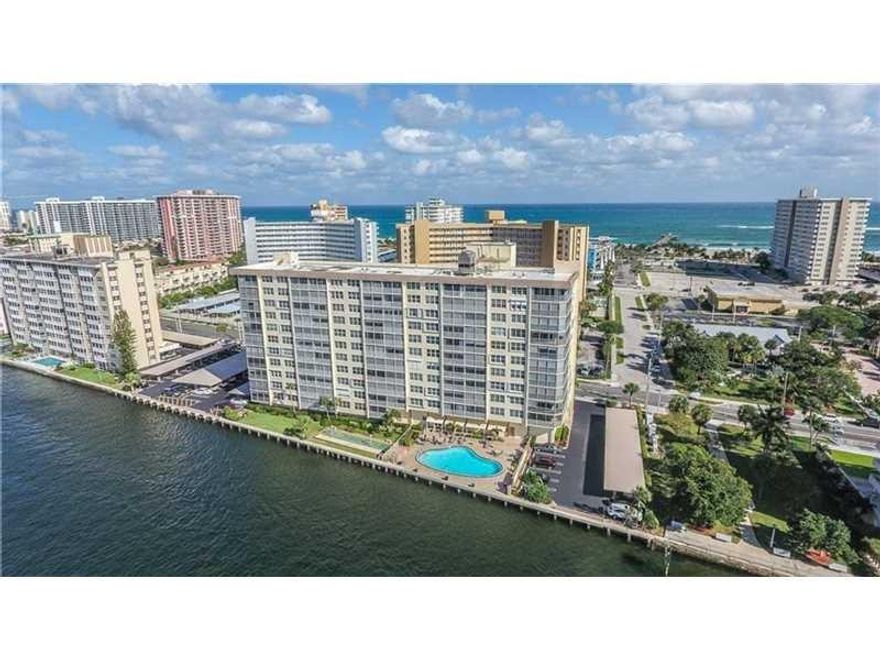 LOCATION, LOCATION, LOCATION...  Direct View of Intracoastal with Incredible Sunsets and Endless Parade of Yachts. Kitchen open for entertaining. Updated Kitchen and baths. New Impact sliding doors and windows. Free Laundry Room, Low Maintenance Fee. Pompano has one of the most beautiful beaches in FL. Fishing Pier, Restaurants, Shops, Marina, Boating, Banks, Library, Bars, Outdoor Gym, Playground, Picnic & BBQ Area all within a few steps from your front door.. Enjoy A True Florida Lifestyle at its Best!