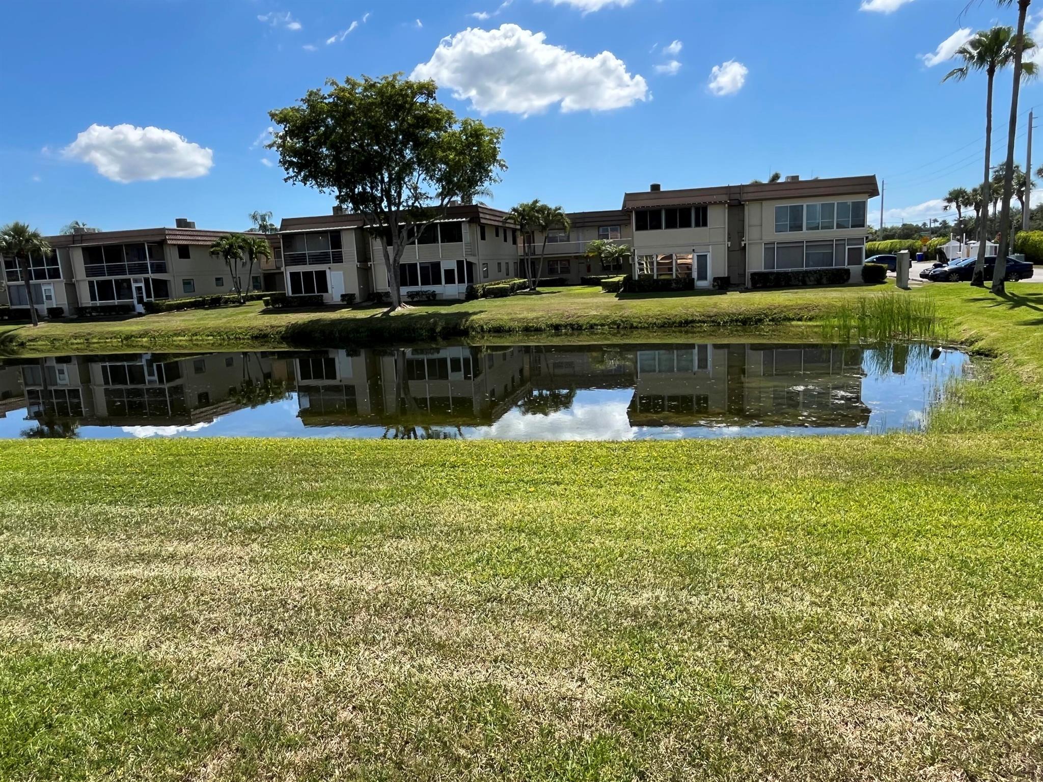 really spectacular and so, so clean ground floor 1/1.5 unit in the Saxony section of Kings Point. The patio faces morning sun (east exposure) overlooking a very peaceful/serene water view. That patio is enclosed with window a/c as well. Tile neutral colored flooring throughout. Washer/dryer in patio utility closet. Updated kitchen and bathrooms. Unit comes fully furnished, so move right in! Parking very close to walkway by the entrance as well. Great unit on the ground floor.