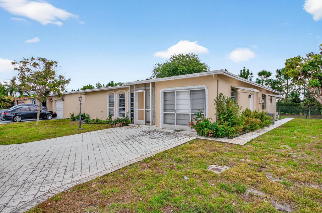 Photo of 1410 NW 48th Pl, Deerfield Beach, FL 33064 (MLS # F10541926)