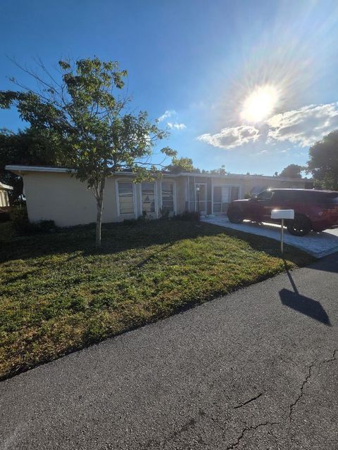 Photo of 1410 NW 48th Pl, Deerfield Beach, FL 33064 (MLS # F10541926)