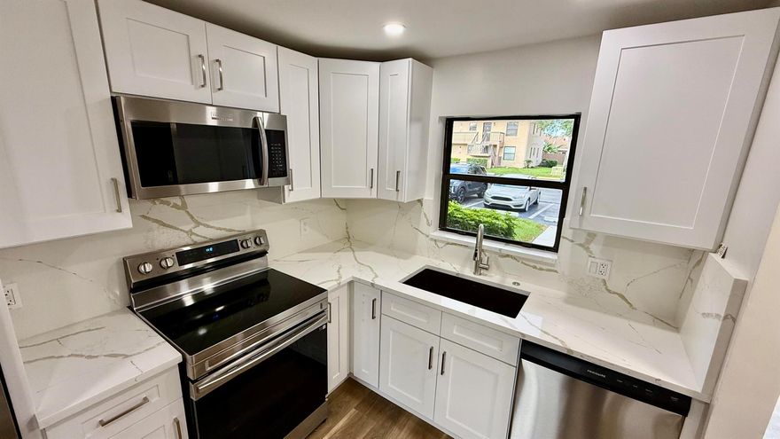 WOW !!Remodeled 2 bedrooms , 2 bathrooms 1st floor condo with lakeview and steps to the community pool .Great Central location at the heart of Boca Raton , close to shops, major roads and shopping .Brand New appliances , flooring , bathrooms , kitchen , light & plumbing fixtures .CAN RENT RIGHT AWAY !! (Easy $2,500 PM)HOA is only $ 350 per month ; water & cable is included in the dues .