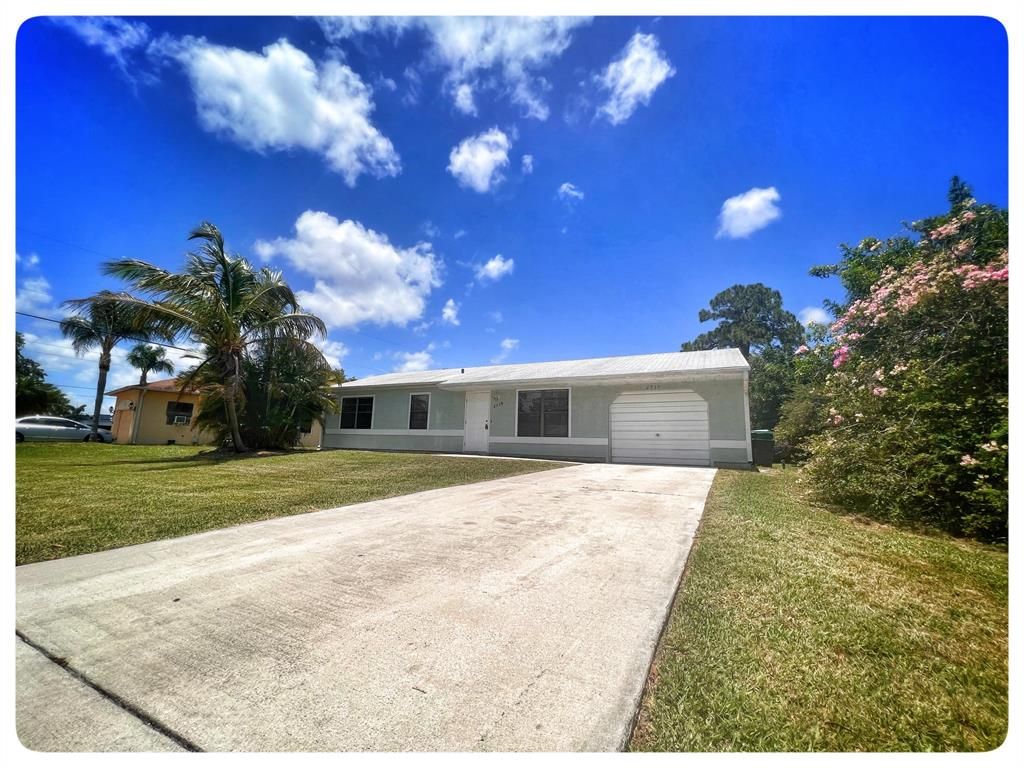 Photo of 2719 SE Bishop Avenue, Port Saint Lucie, FL 34952 (MLS # R10803249)