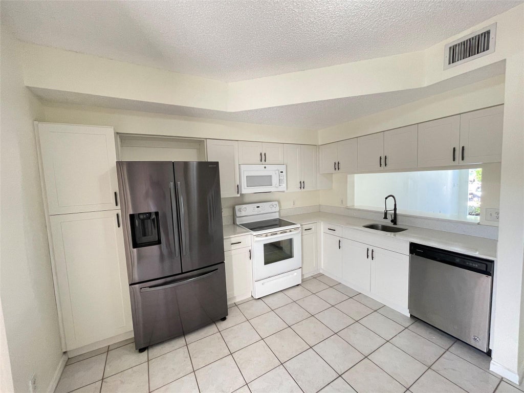 Photo of 9844 NW 56th Place, Coral Springs, FL 33076 (MLS # F10544960)