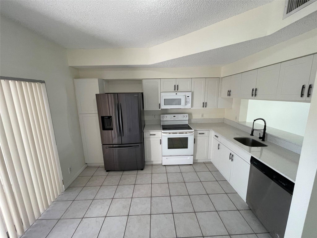 Photo of 9844 NW 56th Place, Coral Springs, FL 33076 (MLS # F10544960)
