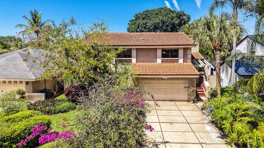 Opportunity awaits in this spacious two-story home in the highly sought-after Vista Verde community. Featuring 3 bedrooms and 3 full bathrooms, it offers one of the best layouts in the neighborhood with great potential to customize and truly make it your own. Ideally located just a few doors down from the community playground, it's perfectly positioned for convenience and everyday enjoyment.  Inside, you'll find high ceilings and generous living areas, providing a solid foundation for updates to match your style. Outside, enjoy a fully fenced backyard with plenty of room to create your dream outdoor oasis—whether you envision a pool, patio, or play area, the possibilities are endless.  Vista Verde is one of Boca Raton's most centrally located communities and is zoned for A-rated Verde K-8 School, conveniently located within the neighborhood. Residents enjoy close proximity to houses of worship less than a mile to the synagogue, Town Center Mall, Restaurant Row, the Swim & Racquet Center, Lynn University, FAU, Uptown Boca, Downtown Boca, major highways including I-95 and the Florida Turnpike, and Boca's beaches.    Listing photos have been virtually enhanced for presentation purposes. The property requires TLC and is being sold in its current AS-IS condition.