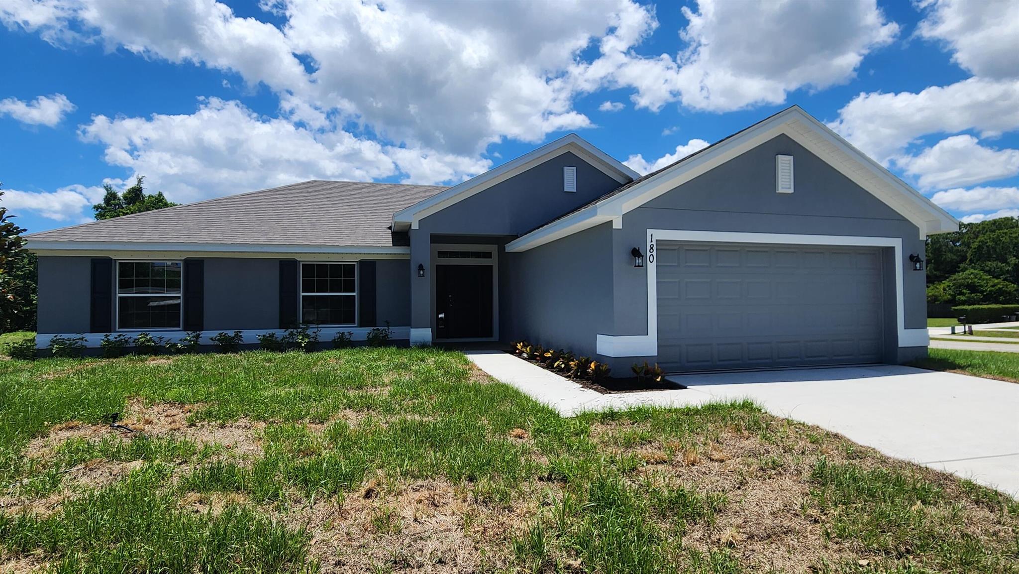 FLEX CASH AVAILABLE! ONLY $1,000 DEPOSIT. Save yourself several thousands of dollars in CLOSING COSTS WHEN USING THE SELLER'S APPROVED LENDER. Your new home is MOVE IN READY and located on a large corner lot with almost 1/2 acre to enjoy! It also features 4 bedrooms, 2 bathrooms large walk in shower and a 2-car garage with vaulted ceilings, tile in main living areas, granite countertops, and a private backyard view from your covered patio. Offering quick access to shopping, dining, parks, beaches & Treasure Coast Mall. Monthly payments starting at $2,700 P&I ONLY. Builder warranty Included.
